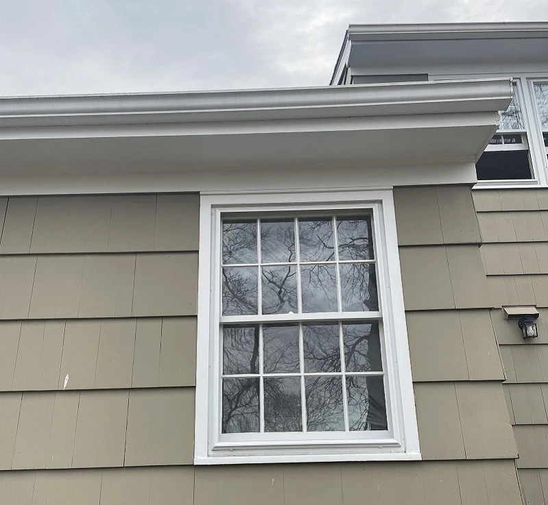 Storm windows on an old double hung window in Fairfield, CT